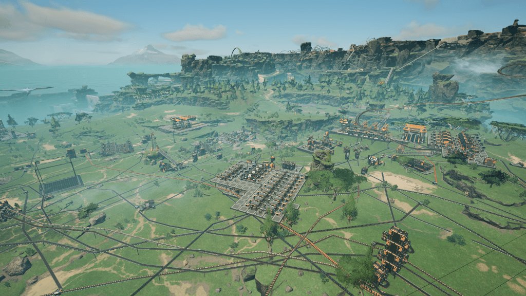 In-game Screenshot. A Satisfactory factory on the vast green plains