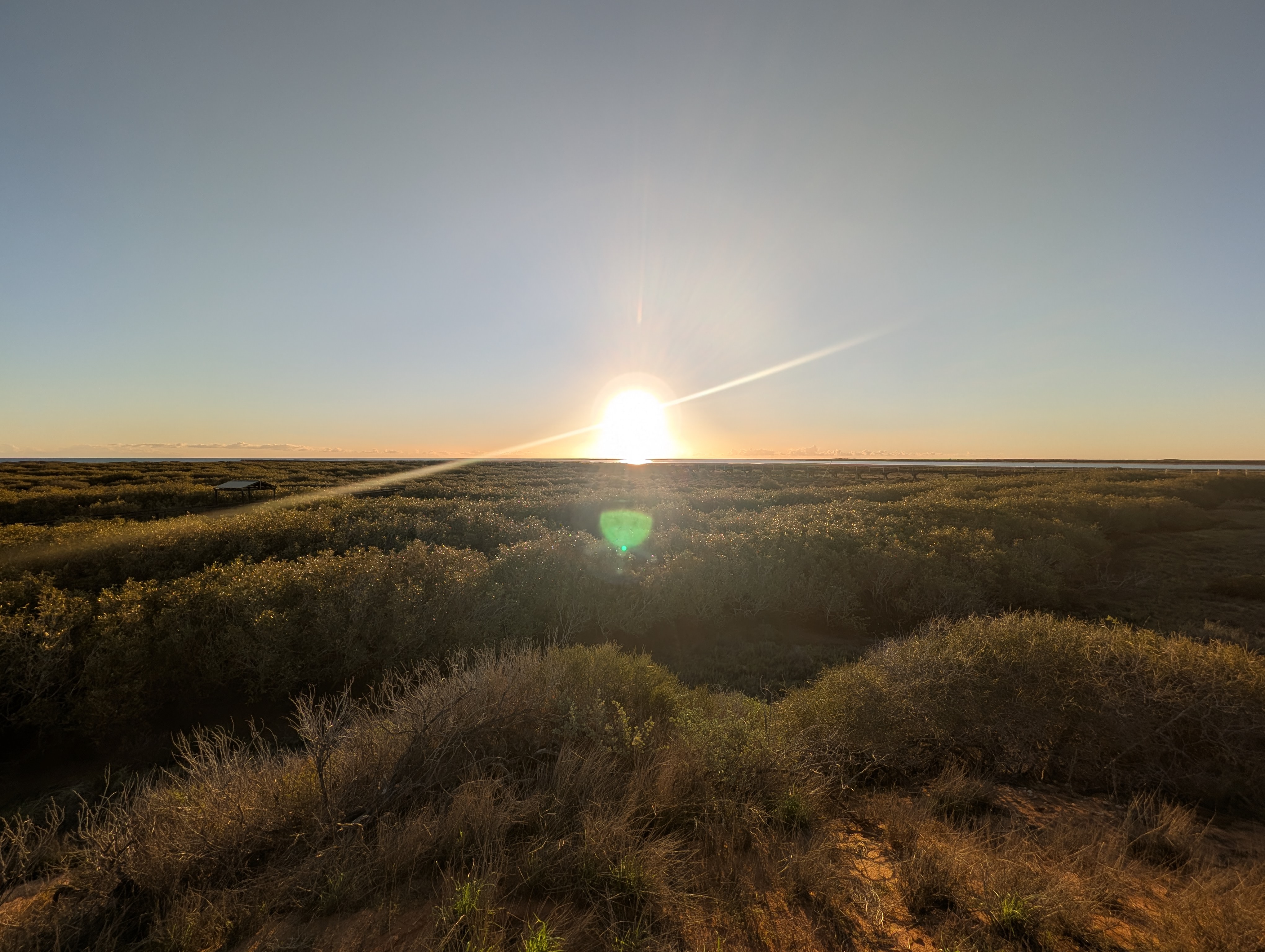 The sun setting on the horizon in Western Australia.