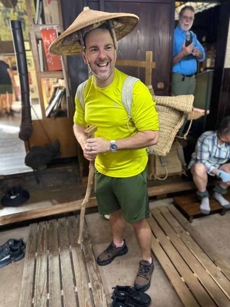 Joaby poses for a photo while wearing the 56kg salt pack. The hat he wears is traditional, the fluro-yellow quick-dry long-sleeve shirt is not.